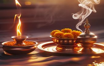 A serene home temple setup with diya flames glowing, a pure copper pooja thali, kalash, and incense smoke rising in warm morning light.-min